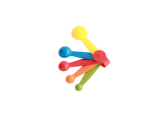 Fototapeta na wymiar Colorful measuring spoons isolated on white