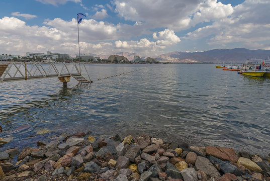 View on the Aqaba gulf from the central beach of Eilat - famous resort and recreational city in Israel