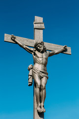 Statue of the Christian cross with Jesus in Cesky Krumlov, Czech
