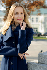 Woman stopped in the street and posing