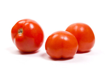 Ripe tomatoes isolated on white