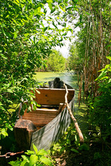 Old wooden boat at the river bank.