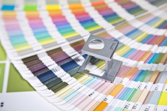 Pantone color palette and magnifying glass