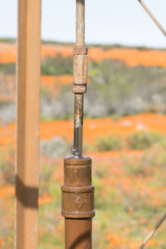 Close-up detail of a water pumping windmill