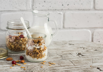 Homemade granola and natural yoghurt on a light wooden surface. Healthy food, healthy Breakfast or...
