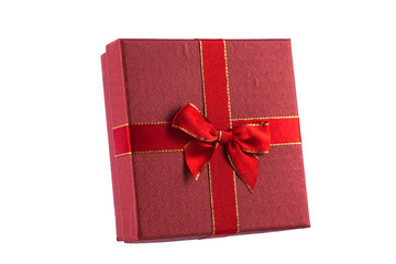 Red gift box with ribbon isolated on white background.