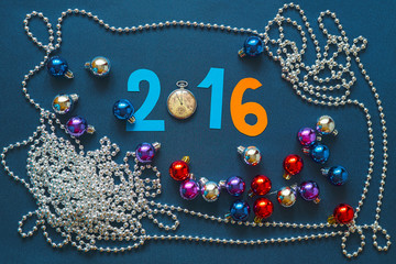 Christmas background with numbers, pocket watches and beads