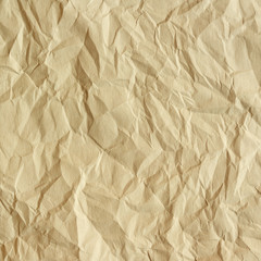 Old crumpled paper texture. Beige paper sheet as background.