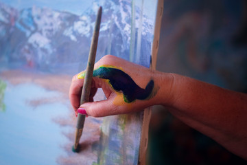 Brush in a painter's hand