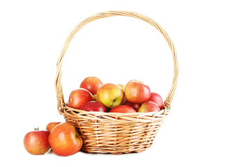 Fresh apples in basket isolated on a white