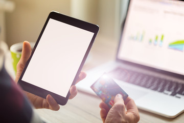 Close-up of man holding digital tablet