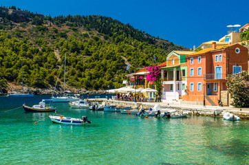 ASSOS TOWN, KEFALONIA ISLAND, GREECE - JULY 12, 2015: Bay of Assos with boats and yachts. Assos village on the Island of Kefalonia in Greece.