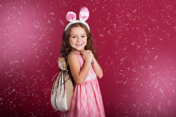 Obraz na płótnie Canvas Child girl is wearing pink ears 