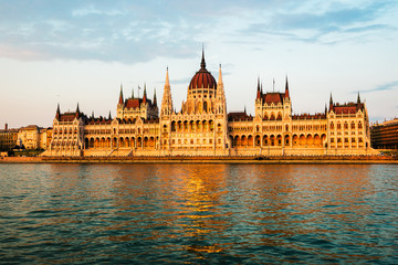 Fototapeta premium Hungarian Parliament on river at sunset, Budapest. Construction started building in 1885 and completed in 1904.