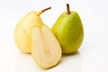 Green and yellow pear with half