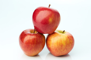 Three red apples isolated on white