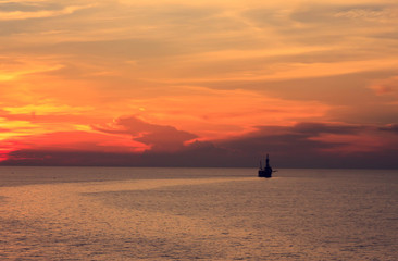 Tender rig,sea,sunset,sky background at gulf of Thailand.
