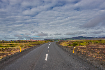 Isolated road and Icelandic landscape at Iceland, summer time
