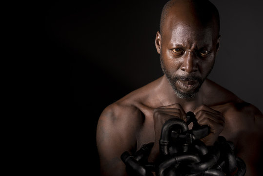 Bare Chested Black Man In Chains