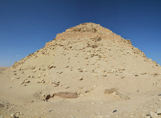 Ruins of pyramid covered with sand