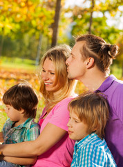 Close-up of happy family sitting together in hug