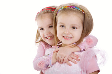 Fototapeta na wymiar Two little girls - best friends on white