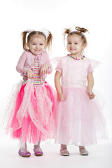 Two little girls - best friends on white
