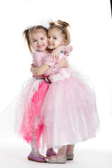 Two little girls - best friends on white