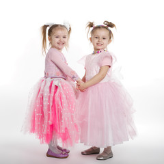 Two little girls - best friends on white