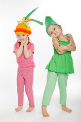 Two little girls with vegetation costumes