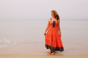 Beautiful woman standing on the beach