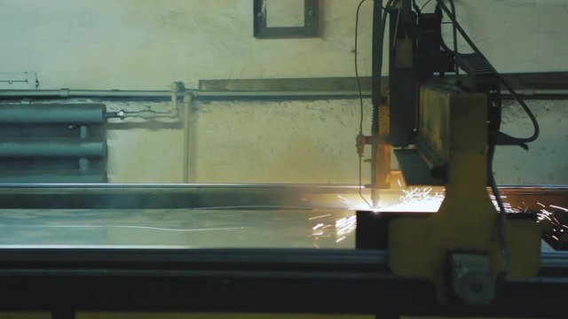 Plasma cutting of a steel plate / Industrial laser or plasma cutting processing manufacture technology of flat sheet metal steel material with sparks