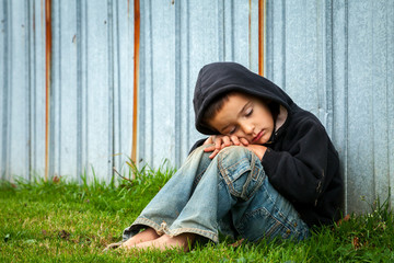 Sad homeless boy