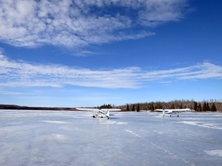 Airplanes on frozen lake
