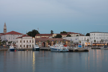 Fototapeta na wymiar Police boats moored in harbor in Koper after sunset time