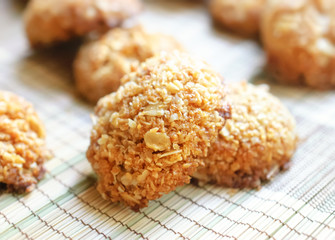 Homemade crispy cereal cookies on rustic wooden board.
