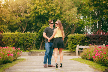 Fototapeta na wymiar Walking couple in park