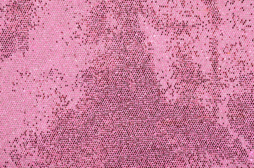 Pink sequins background. Sparkling sequins fabric pattern.