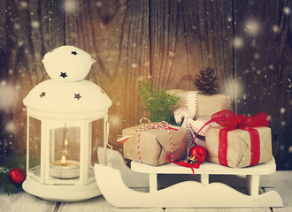 Christmas gifts and candle. Toned image