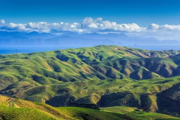 Foto op Plexiglas green hills and sea landscape © skylynxdesign