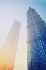 Sunrise behing the Shanghai World Financial Centre and Jin Mao Tower at Lujiazui district in Shanghai. 