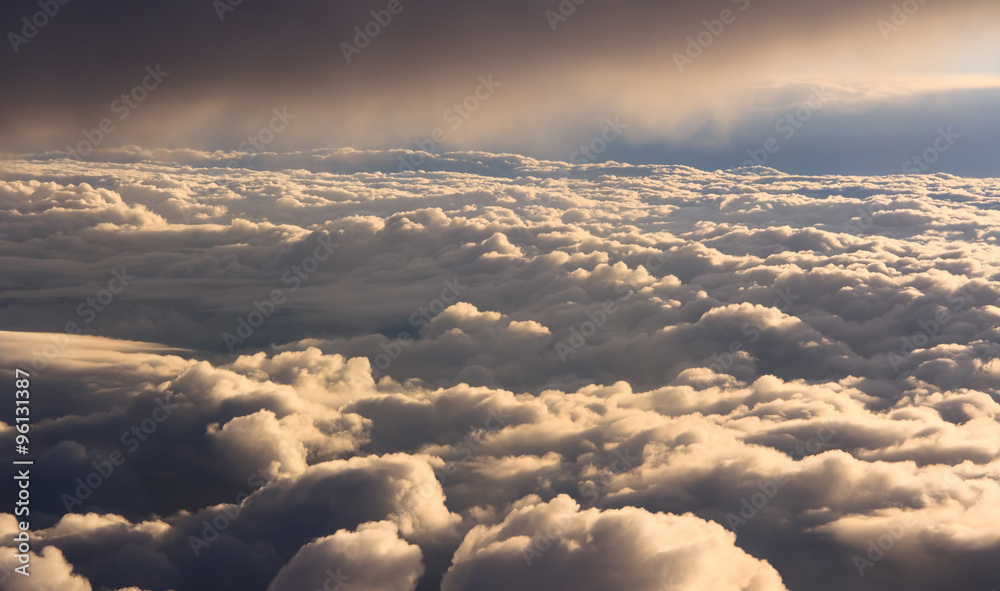 Wall mural fluffy clouds aerial view