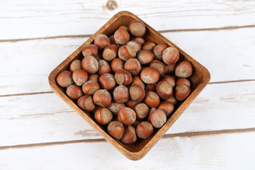 Hazelnuts in a wooden bowl