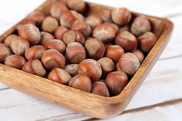Hazelnuts in a wooden bowl