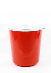 Red plastic food container on white background