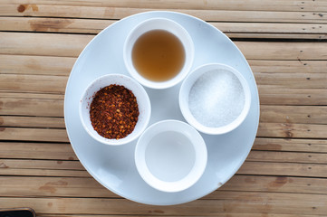 Thai seasoning container include cayenne pepper, sugar, fish sau