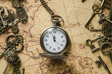 pocket or pendant watch on vintage map background