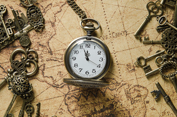 pocket or pendant watch on vintage map background