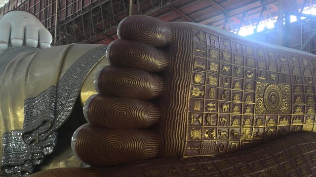 Chauk htat gyi reclining buddha (sweet eye buddha) in yangon, myanmar