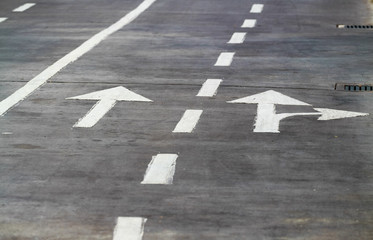 arrow Sign Point on the Road.